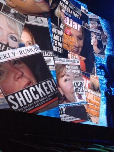 "Paparazzi" took pictures of audience members before the show.  Those pics were transferred to "tabloids" projected on the walls beside the stage.